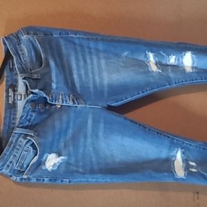 Judy blue jeans skinny fit 15/32.  Distressed with thermal patches.
